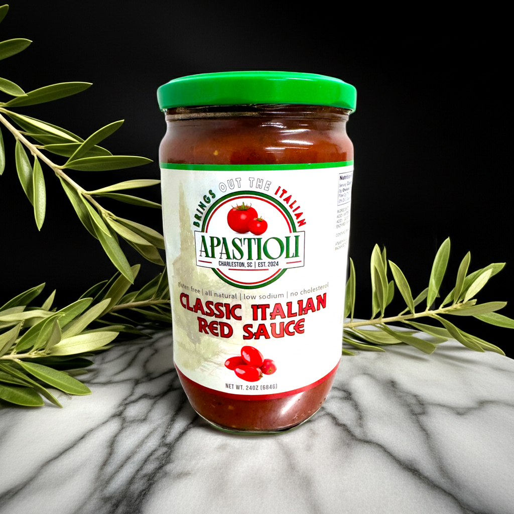 Jar of Apastioli Classic Italian Red Sauce on a marble surface with olive branches.